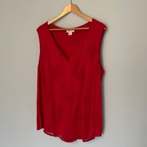 red sleeveless tank top with embroidered pattern
